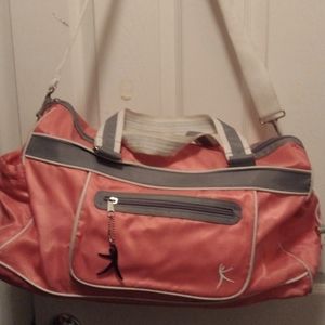 Danskin pink & gray white trim duffle midsize bag.